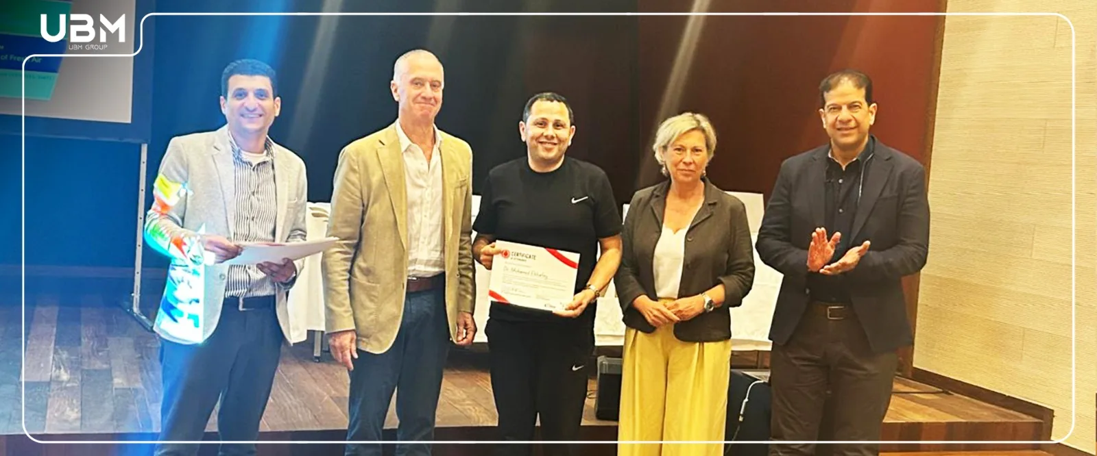 UBM celebrates a participant during the Porto scientific sessions